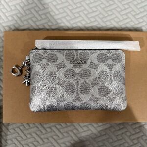 Coach Boxed Corner Zip Wristlet
In Signature Canvas With Charms in silver